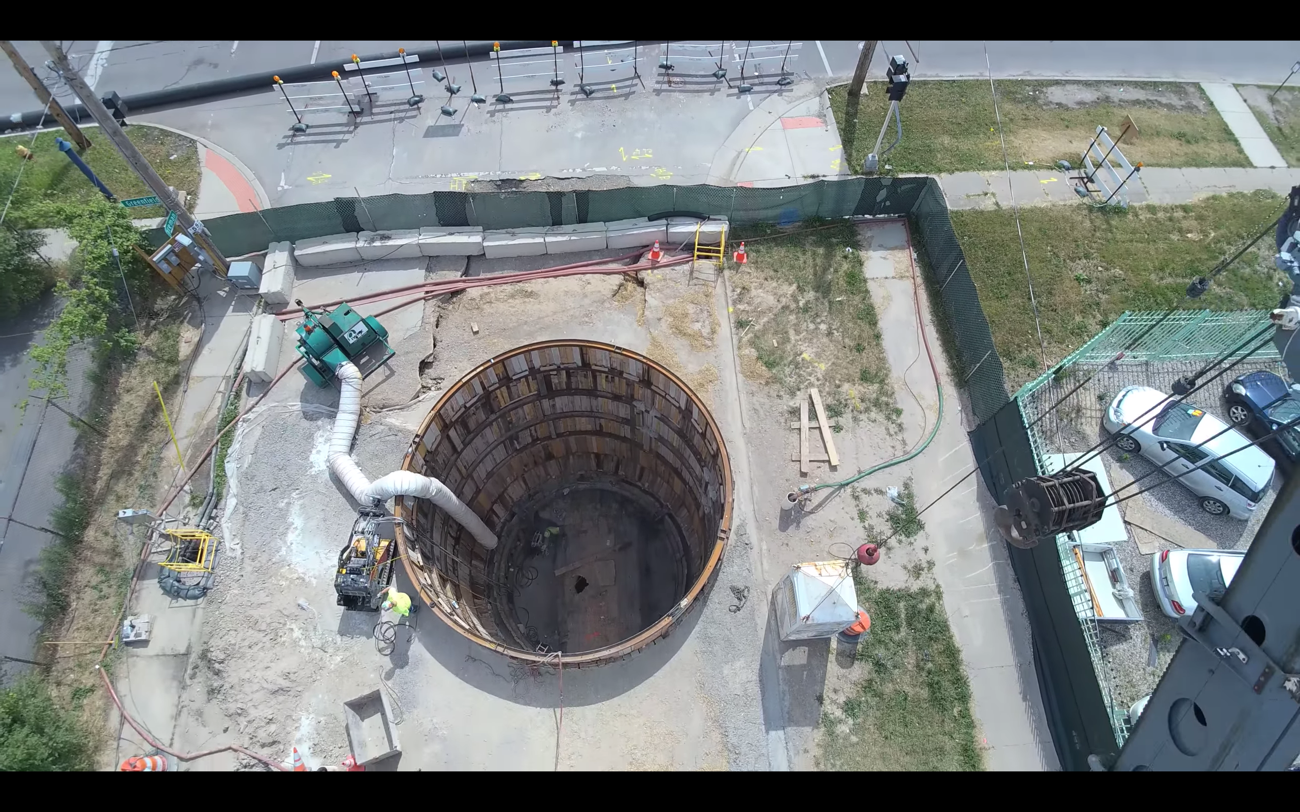 Aerial view of a construction shaft and surrounding project site