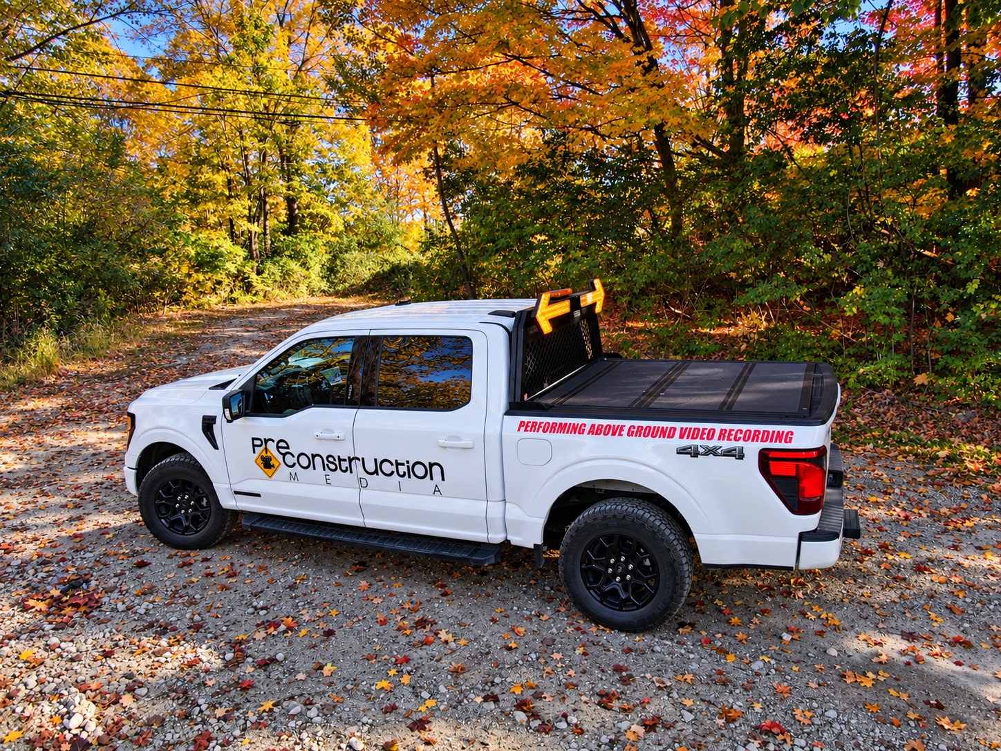 Pre-Construction Media branded pickup truck for field video documentation